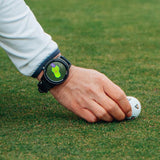 Golfer wearing the GOLFBUDDY aim W11 GPS while lining up a TaylorMade TP5 pix
